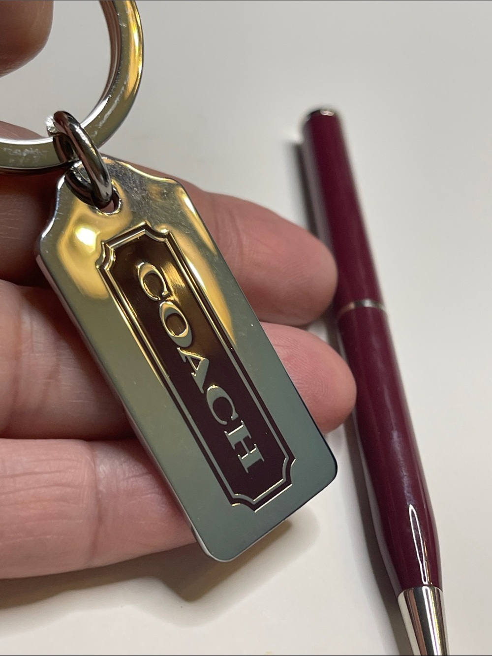 Coach Metal Key Tag - Burgundy Enamel and Coach Pen